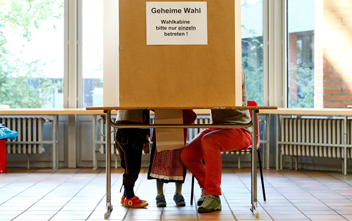 People in traditional Bavarian costumes vote in the general election (Bundestagswahl) in Munich, Germany, September 24, 2017