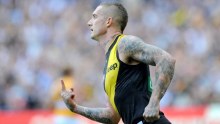 Dustin Martin of the Tigers reacts after kicking a goal against West Coast at the MCG in April 2017.