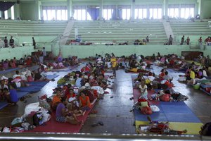 Villagers gather in their temporary shelter in Klungkung,  Bali, Indonesia on Saturday, Sept. 23, 2017