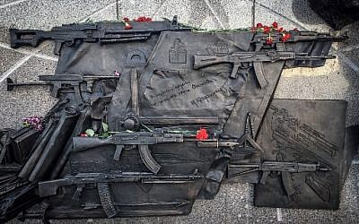 A sketch allegedly featuring the German StG44 rifle at a fragment of the newly unveiled monument to Mikhail Kalashnikov, the inventor of the AK-47 assault rifle, in downtown Moscow on September 22, 2017. (AFP/Mladen Antonov)