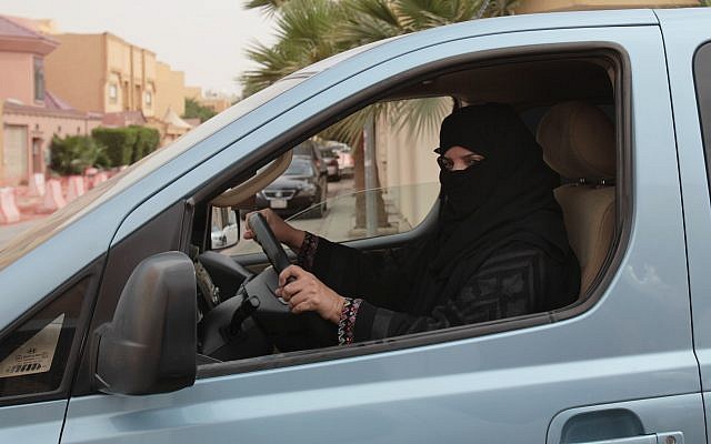 In this file photo from March 29, 2014, a  woman drives a car in Riyadh, Saudi Arabia, as part of a campaign to defy the country's ban on women driving. (AP Photo/Hasan Jamali, File)