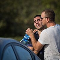 Local residents at the Har Adar settlement, outside Jerusalem, on September 26, 2017, pictured after a Palestinian terrorist killed two security officers and a border policeman there, and seriously injuring another man. (Hadas Parush/FLASH90)