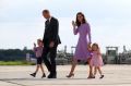 Britain's Prince William, his wife Kate, and their children, Prince George and Princess Charlotte in Germany in July.