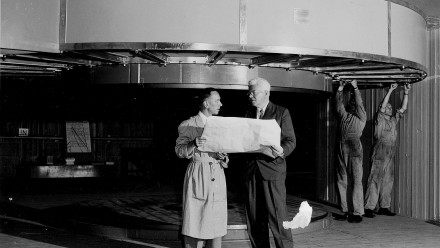 Professor Mark Oliphant discusses the specifications of the homopolar generator with his senior technical officer, Mr Jimmy Edwards, 1953