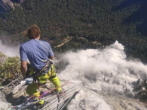 In this photo provided by Peter Zabrok, climber Ryan Sheridan who had just reached the top of El Capitan, a 7,569-foot (2,307 meter) formation, when a rock slide let loose below him Thursday, Sept. 28, 2017, in Yosemite National Park, Calif.