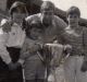 Caroline Wilson with sister Amelia, brother Will, Bill Barrot and the 1969 premiership cup.