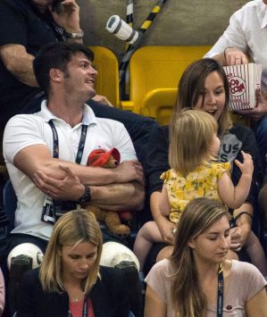 Prince Harry sits with spectators during the sitting volleyball competition at the Invictus Games in Toronto on ...