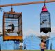 Pet birds hang in cages from a makeshift standat an evacuation camp in Klungkung, home to thousands of evacuees. 