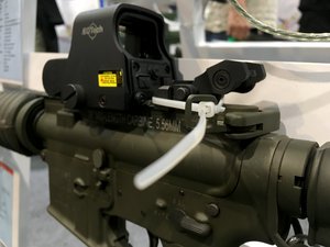 Mid-length carbine 5.56mm rifle on display at a gun show. Taken on July 2017.