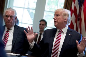 Secretary of State Rex Tillerson, left, and White House Senior Adviser Jared Kushner listen as President Donald Trump speaks during a Cabinet meeting, Monday, June 12, 2017, in the Cabinet Room of the White House in Washington.