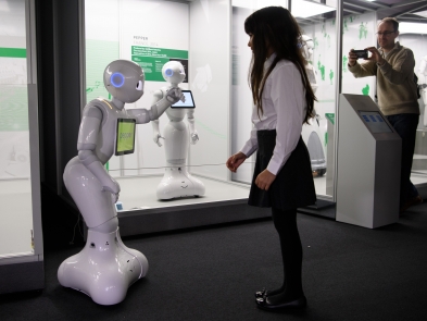 Pepper the robot with a child