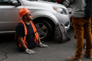 Volunteer Victor Serrano arrives to help in the recovery efforts at the corner of Alvaro Obregon and Yucatan streets in ...