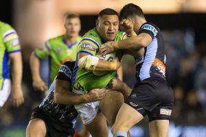 Josh Papalii of the Raiders is tackled by Chad Townsend.