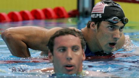 Friend or foe: Long term rivals in the pool, Michael Phelps and Grant Hackett have a lot to do with each other in private.