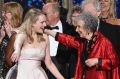 Elisabeth Moss, left, and author Margaret Atwood embrace as "The Handmaid's Tale" wins the award for outstanding drama ...