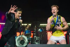 Jack Riewoldt and Brandon Flowers on stage after the grand final.