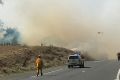 A grass fire is seen along the Hume Highway, north of Goulburn.