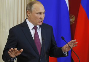 Russian President Vladimir Putin speaks at a joint news conference with Moldovan President Igor Dodon in the Kremlin in Moscow, Russia, Tuesday, Jan. 17, 2017.