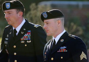 Army Sgt. Bowe Bergdahl, right, arrives for a pretrial hearing at Fort Bragg, N.C., with his defense counsel Lt. Col. Franklin D. Rosenblatt, left, on Tuesday, Jan. 12, 2016