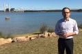 Greens deputy leader Adam Bandt in front of the Liddell and Bayswater coal-fired power stations.