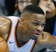 Oklahoma City Thunder guard Russell Westbrook (left) falls as he drives around Melbourne United's Casper Ware.