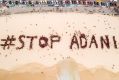 Organisers estimated 1500 people gathered on Bondi Beach on Saturday to protest the Adani mine.