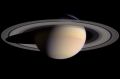 This composite of two images, taken by the Cassini spacecraft, shows a wide view of Saturn. The white dots in the image ...