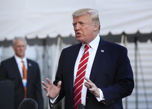 President Donald Trump speaks to reporters before leaving the White House in Washington, Saturday, Oct. 7, 2017 for a brief stop at Andrews Air Force Base in Md., on his way to Greensboro, N.C.