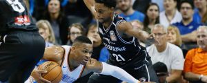 Oklahoma City Thunder guard Russell Westbrook (left) falls as he drives around Melbourne United's Casper Ware.