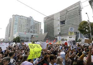 Supporters of the Deferred Action for Childhood Arrivals (DACA) yell during a protest outside of the Federal Building in San Francisco, Tuesday, Sept. 5, 2017.