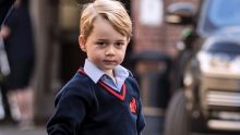 Britain's Prince George arrives for his first day of school at Thomas's school in Battersea, London.