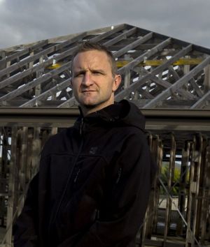 Mr Draper in front of the unfinished Simonds house on the Wallan site last year. 