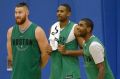 Aron Baynes (left) with Celtics teammates Al Horford and Kyrie Irving.