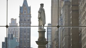 The Christopher Columbus statue at Manhattan's Columbus Circle, center, is shown from a view inside the Time Warner Center, Sunday Aug. 27, 2017, in New York.