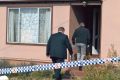 Police at the Oberon home where the boy was killed. 