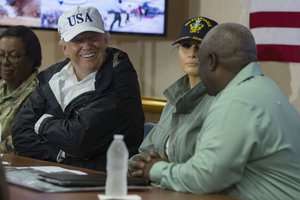 President Donald Trump speaks with Governor Kenneth Mapp, Governor of the U.S. Virgin Islands, about ongoing operations in Puerto Rico and the U.S. Virgin Islands during a trip to the amphibious assault ship USS Kearsarge (LHD 3). Kearsarge is assisting with relief efforts in the aftermath of Hurricane Maria, Oct. 3, 2017 .