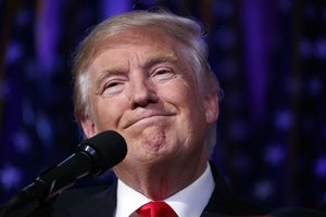 President-elect Donald Trump smiles as he arrives to speak at an election night rally, Wednesday, Nov. 9, 2016, in New York.