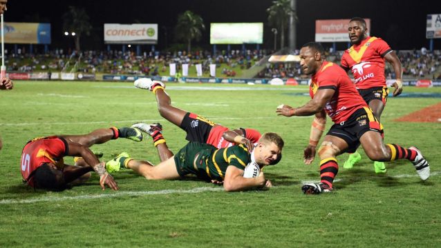 Unstoppable: Tom Trbojevic dives over for the Kagaroos in Suva.