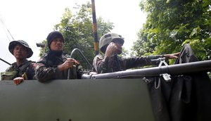 Government troops head back to the site as they battle Muslim militants who lay siege in Marawi in southern Philippines Thursday, May 25, 2017.