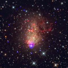 File - In 1887, American astronomer Lewis Swift discovered a glowing cloud, or nebula, that turned out to be a small galaxy about 2.2 million light years from Earth. Today, it is known as the “starburst” galaxy IC 10, referring to the intense star formation activity occurring there.     For the first time, NASA scientists have detected light tied to a gravitational-wave event, thanks to two merging neutron stars in the galaxy NGC 4993, located about 130 million light-years from Earth in the constellation Hydra.