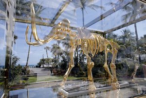 In this Tuesday, Feb. 14, 2017 photo, a mammoth skeleton sculpture by artist Damien Hurst is displayed at the Faena Hotel in Miami Beach, Fla.