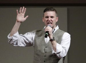 Richard Spencer, who leads a movement that mixes racism, white nationalism and populism, speaks at the Texas A&M University campus Tuesday, Dec. 6, 2016, in College Station, Texas. Texas A&M officials say they didn't schedule the speech by Spencer, who was invited to speak by a former student who reserved campus space available to the public. (AP Photo/David J. Phillip)