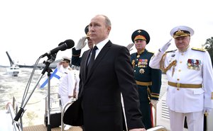 Vladimir Putin addresses the military parade during the Navy Day celebration in St.Petersburg, Russia