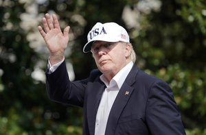 President Donald Trump waves as he walks across the South Lawn of the White House in Washington, Sunday, Aug. 27, 2017, following his return after spending the weekend at nearby Camp David, Md.