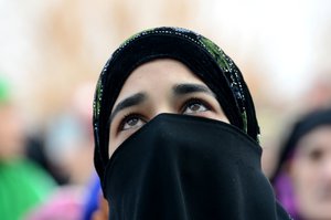 A Kashmiri Muslim woman prays during prayers following the Islamic festival of Eid-e-Milad, the Prophet Muhammad's birthday in Srinagar, the summer capital of Indian Kashmir, 12 December 2016. Hundreds of Muslims thronged at the Hazratbal shrine, which houses a relic believed to be a hair from the beard of Prophet Muhammad (PBUH).