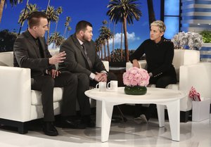 In this Oct. 17, 2017, photo released by Warner Bros., Stephen Schuck, left, and Jesus Campos appear with host Ellen Degeneres during a taping of "The Ellen DeGeneres Show" at the Warner Bros. lot in Burbank, Calif.