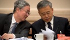 Zhou Xiaochuan, left, chats with Guo Shuqing, chairman of the China Banking Regulatory Commission, in Beijing on Thursday. 