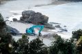 The dead whale being buried on Nobbys Beach, Port Macquarie. 