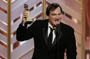 Director Quentin Tarantino accepts a Golden Globe Award for The Hateful Eight in January 2016.