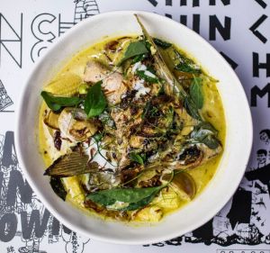 Go-to dish: Green curry with grilled fish wing, pea eggplant and baby corn.